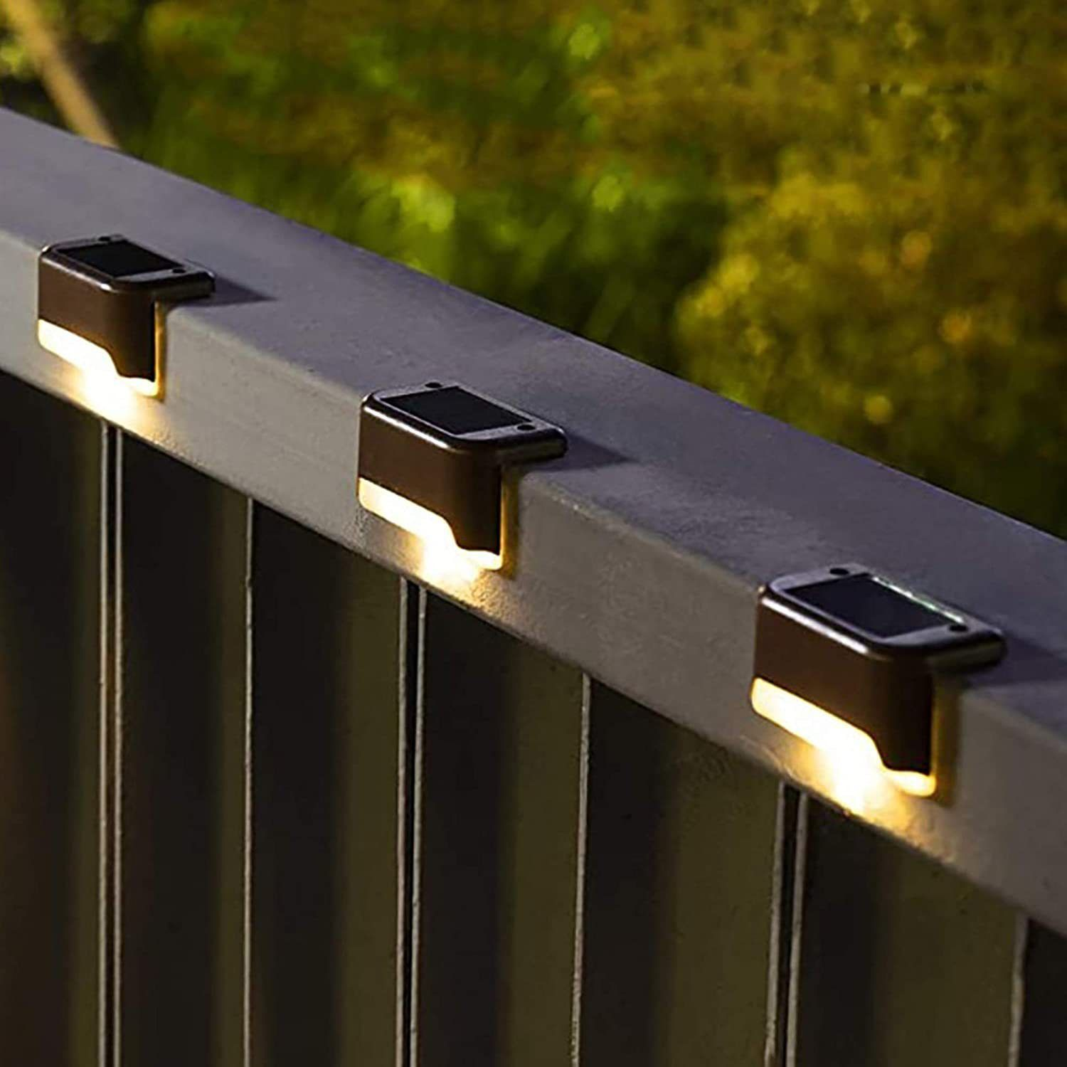 Supplier photo of warm solar lights along a fence rail
